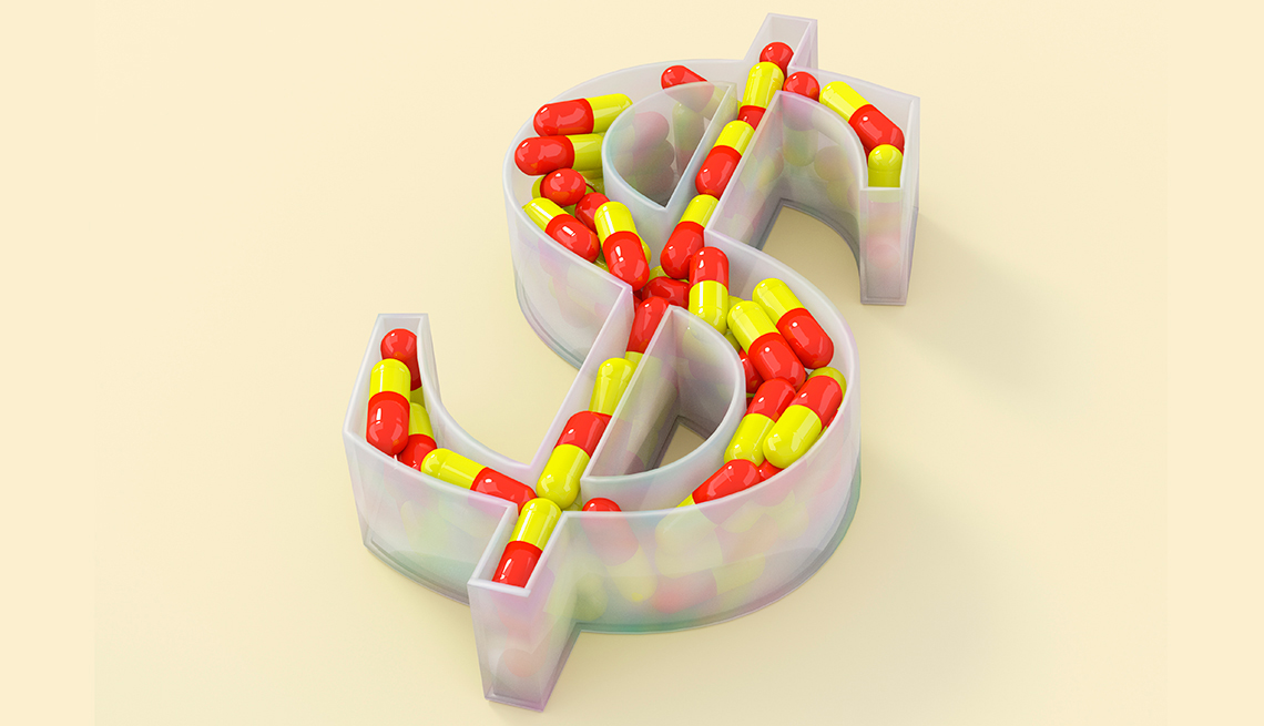 Envase en forma de signo de dólar lleno de medicamentos
