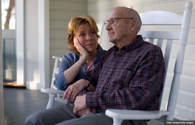 Father and daughter sitting together, caregiving questions answered