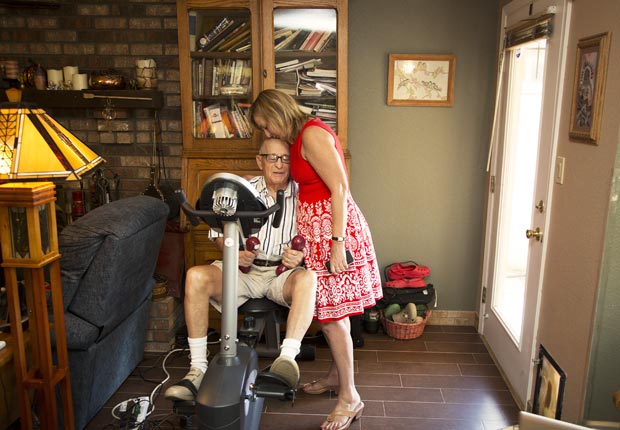 Amy Goyer kisses her father's forehead, Juggling Work and Caregiving (Beth Perkins Photography)