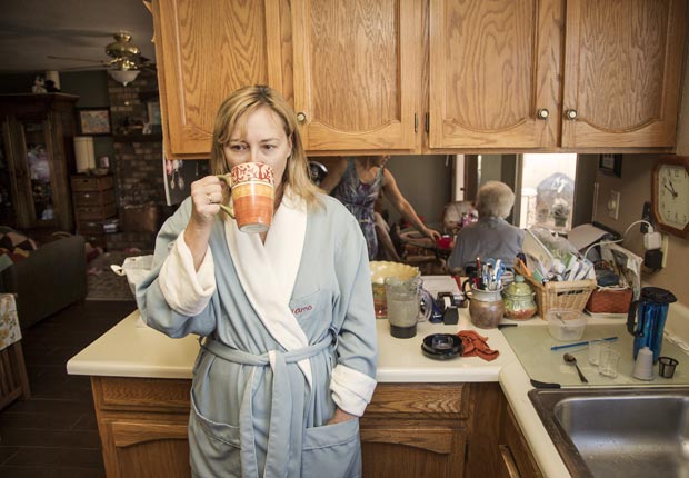 Amy Goyer at her home in the morning, waking up early to work and spend time with parents, Juggling Work and Caregiving (Beth Perkins Photography)