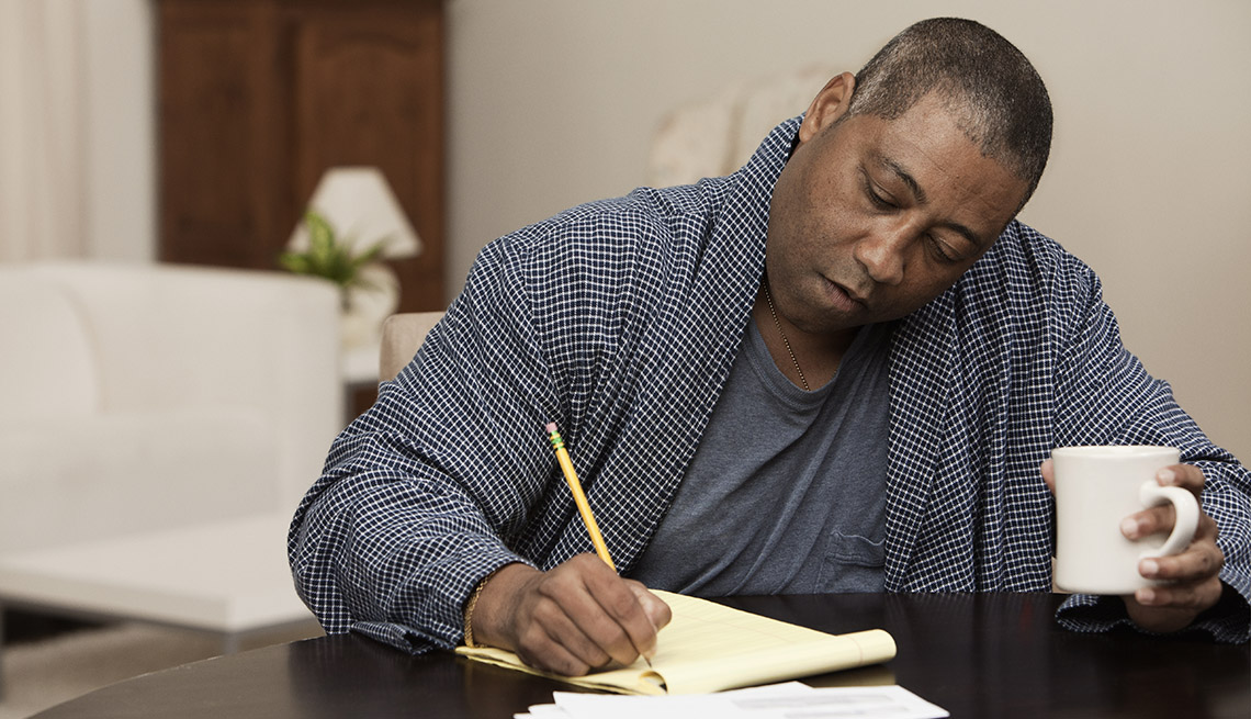 African American Man Writing Down His Health History, Recording Your Health History