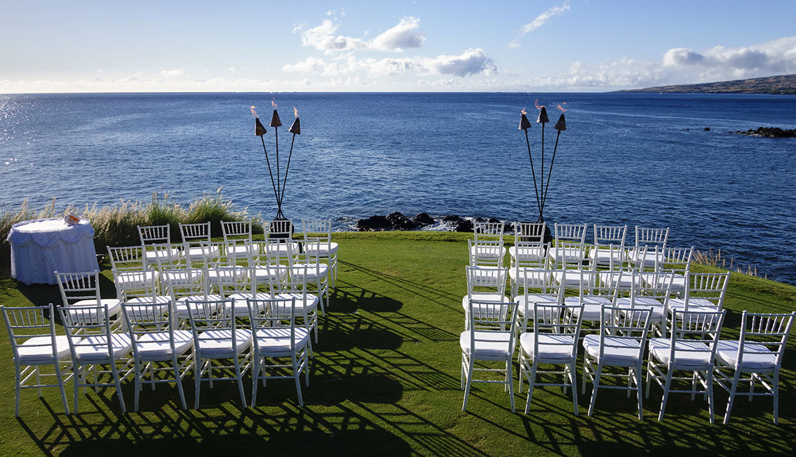 Chairs And Tables Are Set Up On A Grassy Hill Overlooking The Ocean For A Wedding, AARP Home And Family, Dating, New Love, New State, New Purpose 