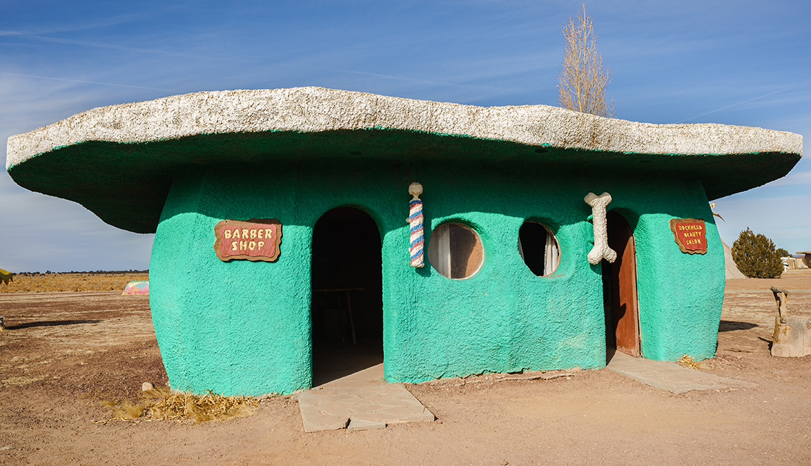 a turquoise flintstones style house in bedrock city arizona