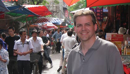 Ken at a street market in Xi’an, China while volunteering in 2009.