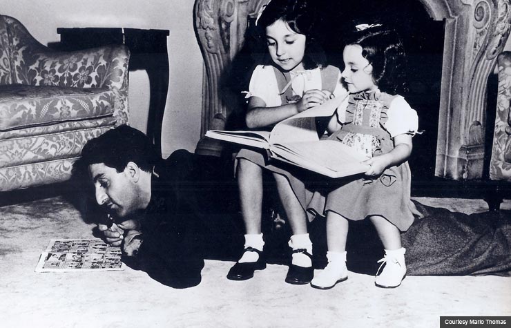 Hitting the books Marlo Thomas at 7, center, reads with father Danny and sister Terre. (Courtesy Marlo Thomas)