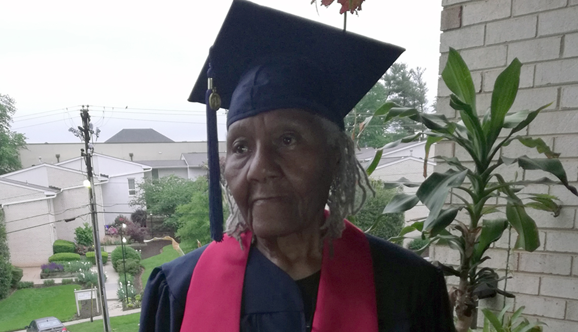 An older woman wearing a cap and gown 