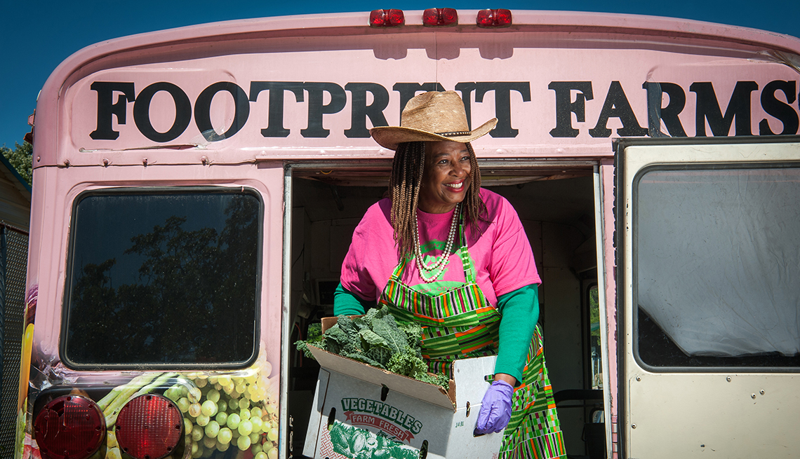 doctor cindy ayers elliott unloads produce from her farms pink bus