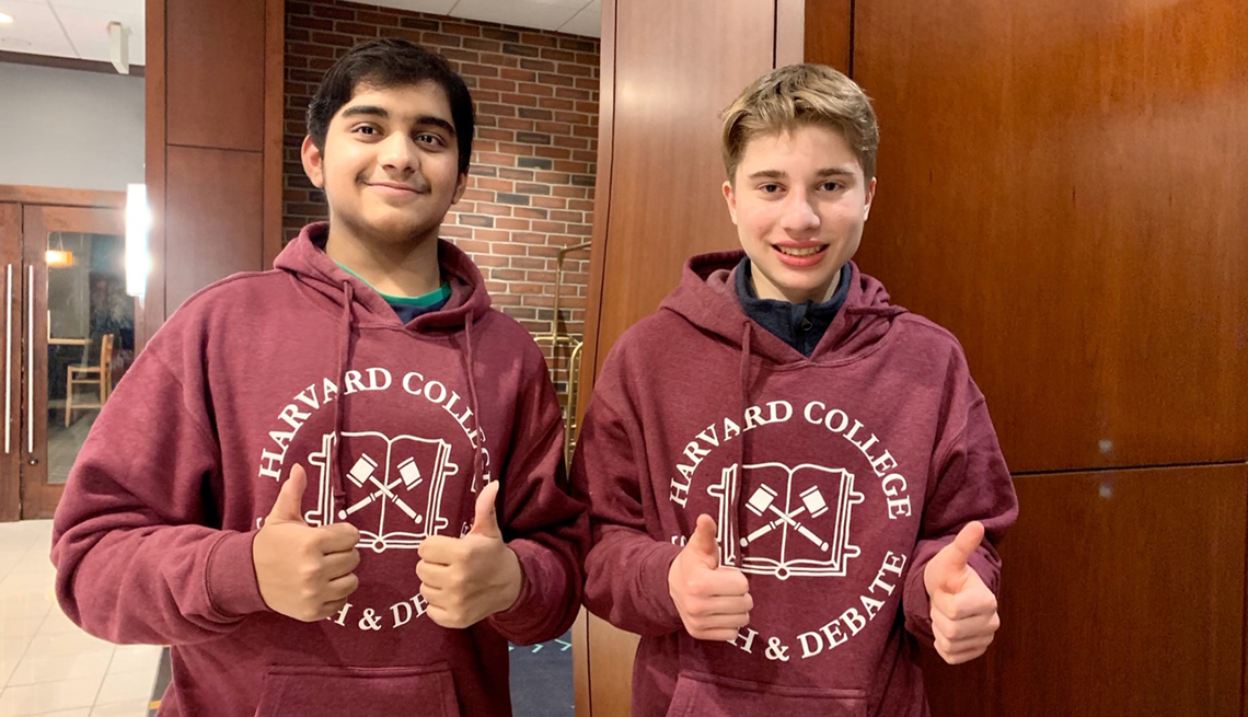 Dhruv and Matthew wearing Harvard College sweatshirts