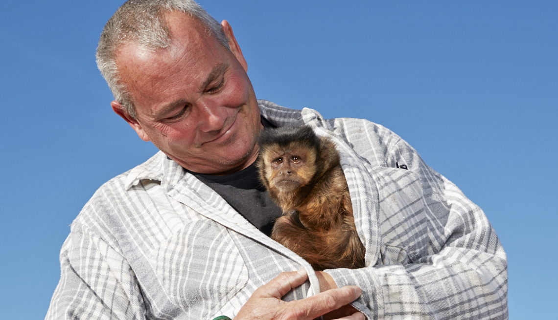 item 5 of Gallery image - Joel Almquist, with his pet monkey Cheeky