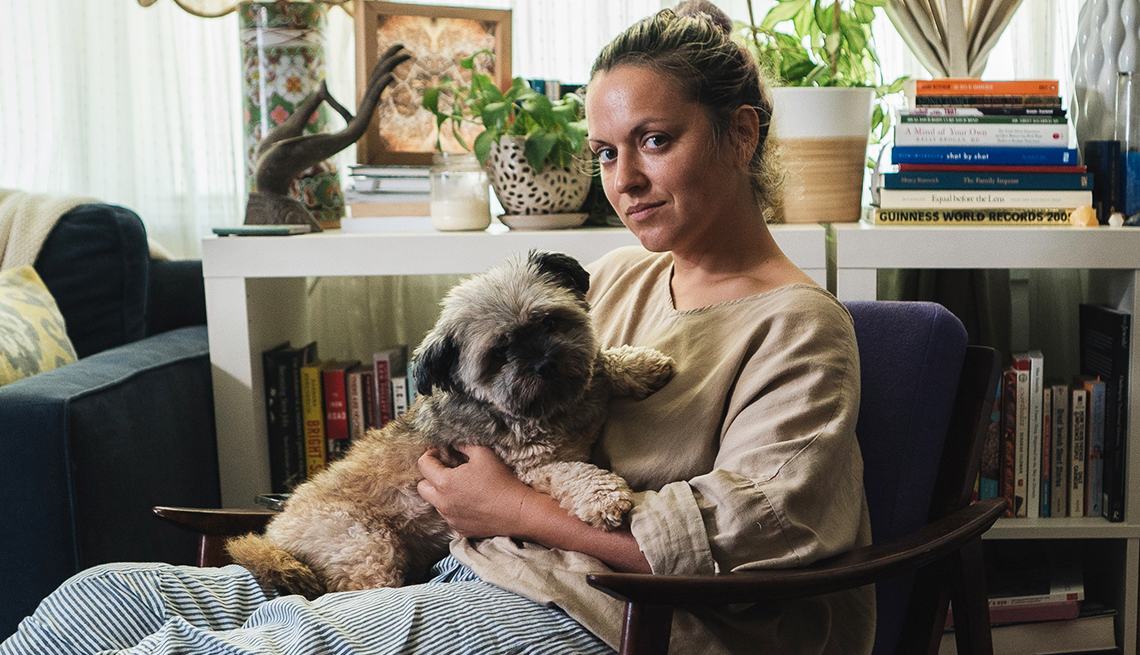 item 12 of Gallery image - jayme gershon holds her dog krizo on her lap