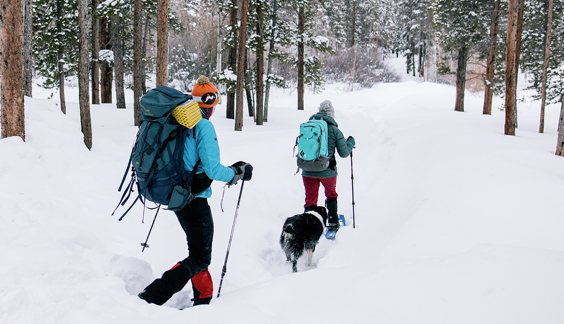  It's important to wear gear, such as leg gaiters, to stay warm and dry when snowshoeing in deep snow.