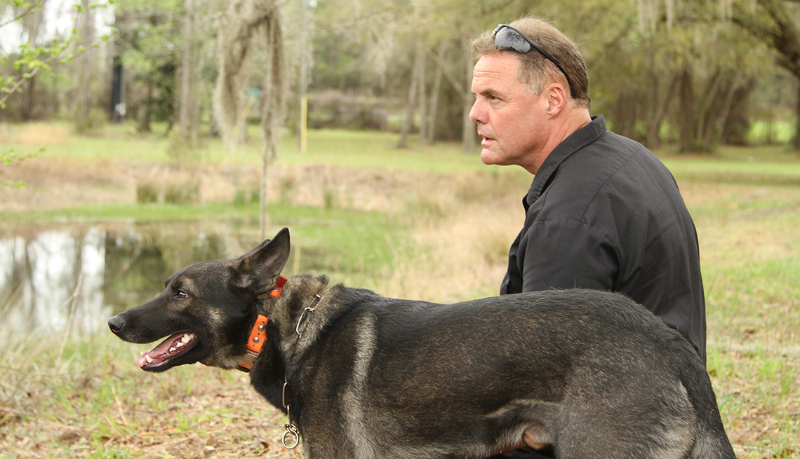 Trainer Jeff Minder helps teach dogs to recognize the scent of COVID-19. 
