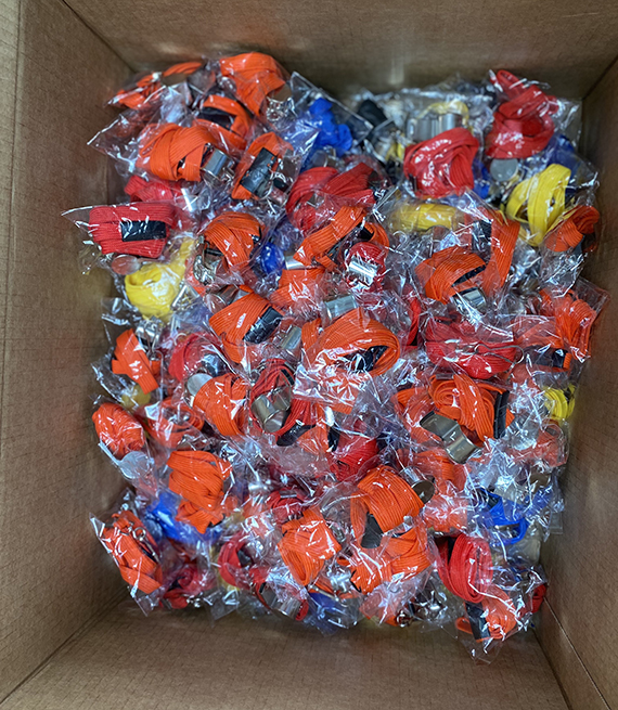An assortment of whistles in a box