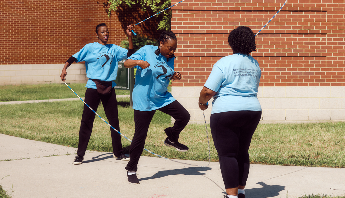 robbin webb left and joy jones center and carlyle prince right doing double dutch jump rope