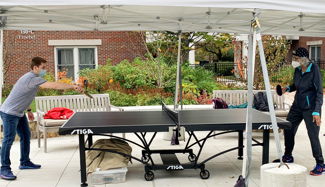residents playing ping-pong in the village of lasell