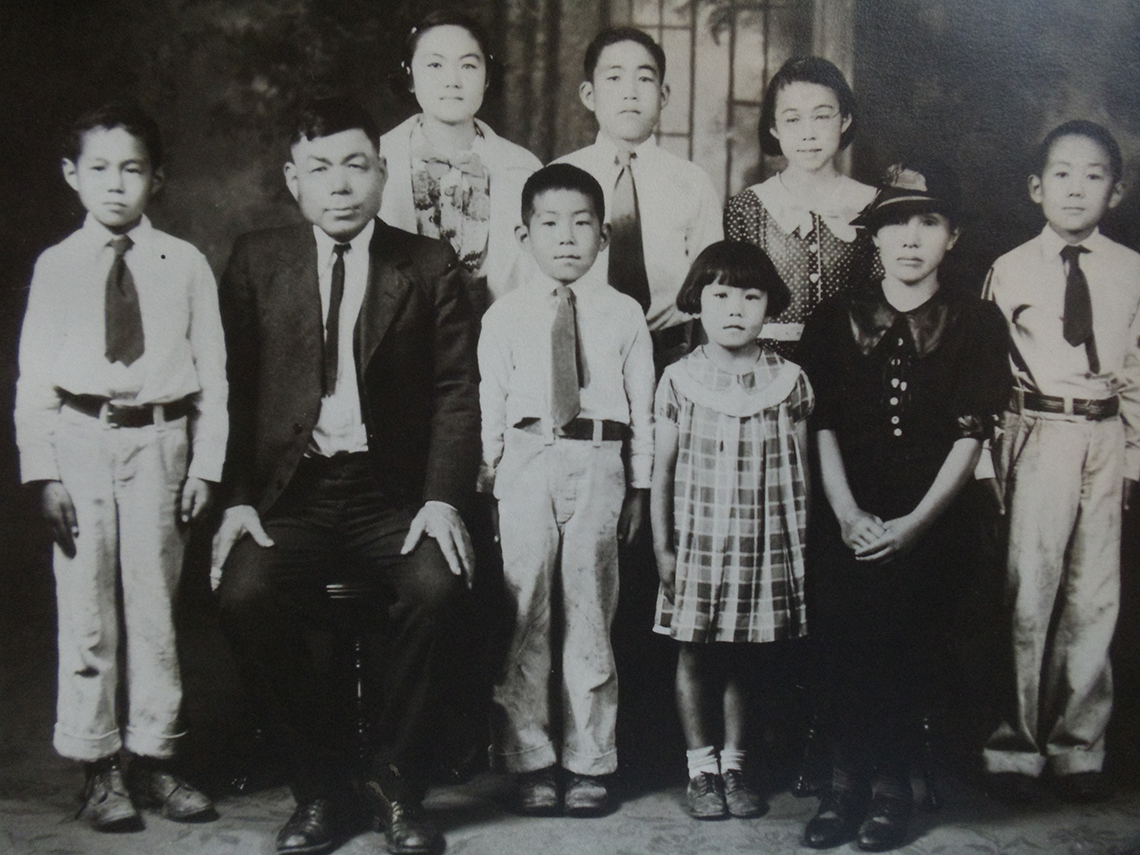 black and white photo of nine people in in dennis katos family taken in nineteen thirty five