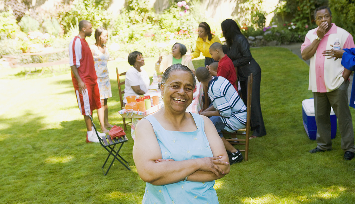 woman with friends and family at outdoor picnic