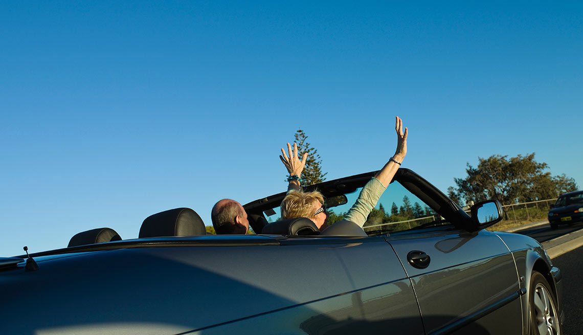 Couple driving in a new car (Photo provided by TrueCar) - AARP Auto Buying Program
