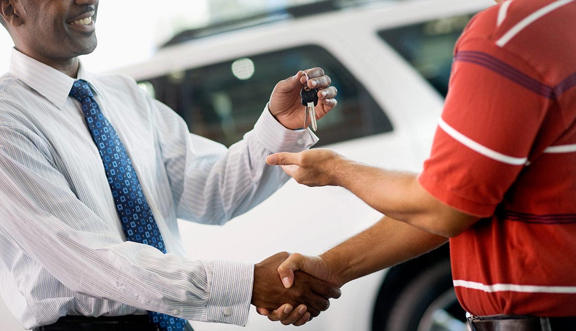 Buying a car - shake hands and keys 
