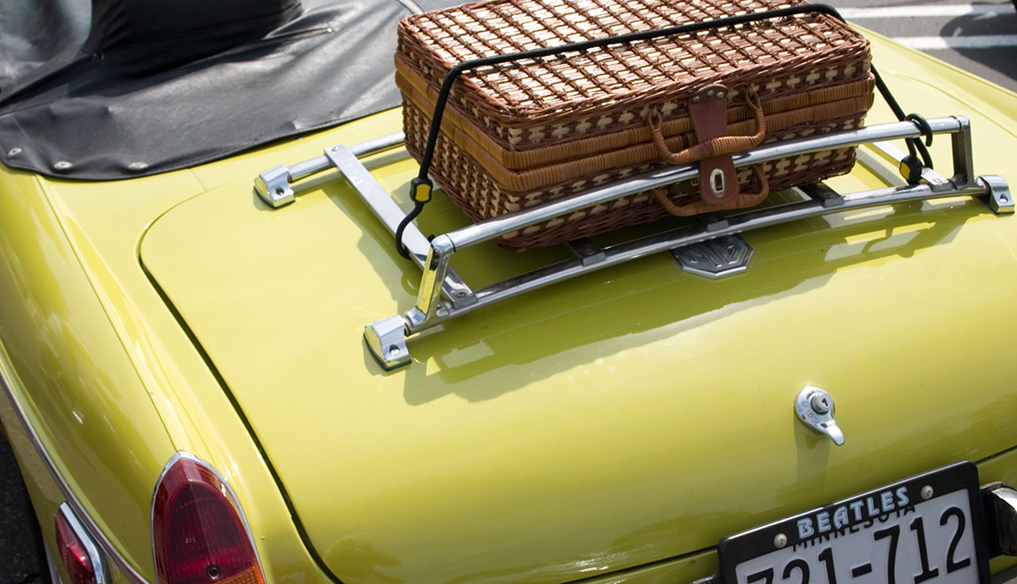 Suitcase on luggage rack, Limited convertible storage space, Pros and Cons of Buying a Convertible
