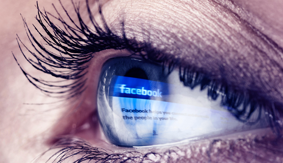 Facebook logo reflected in eye