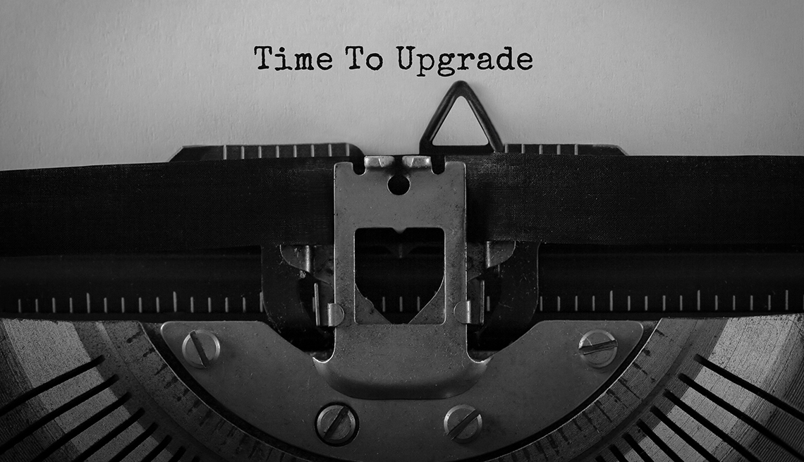 black and white image of paper in a typewriter with the words 'time to upgrade'