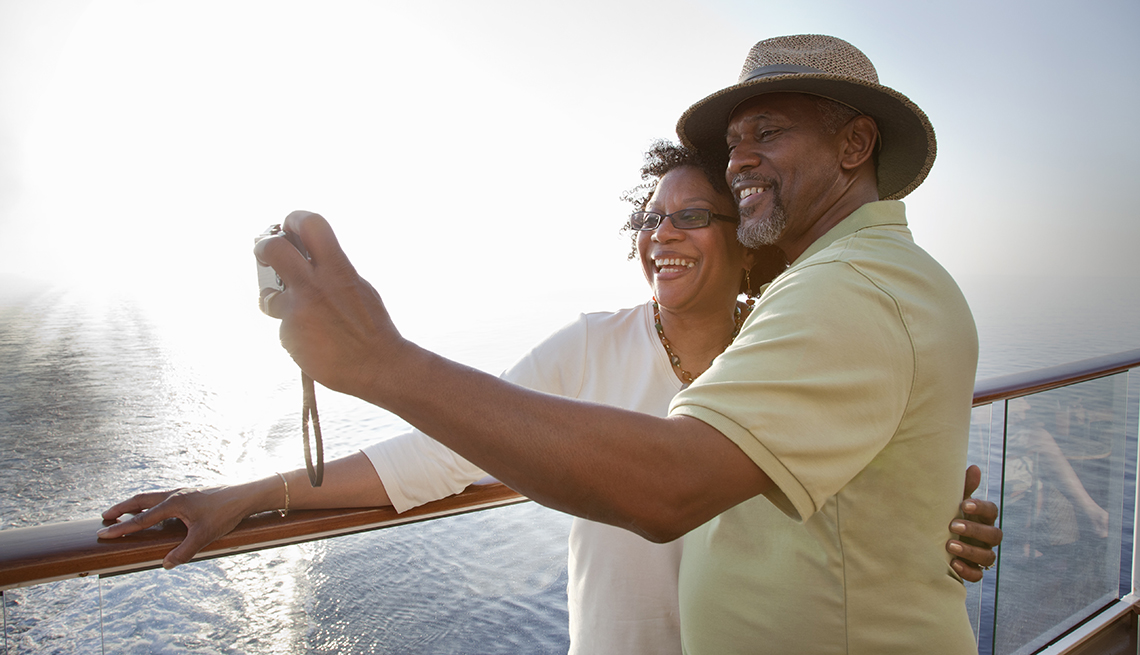 a couple takes a selfie on board a boat