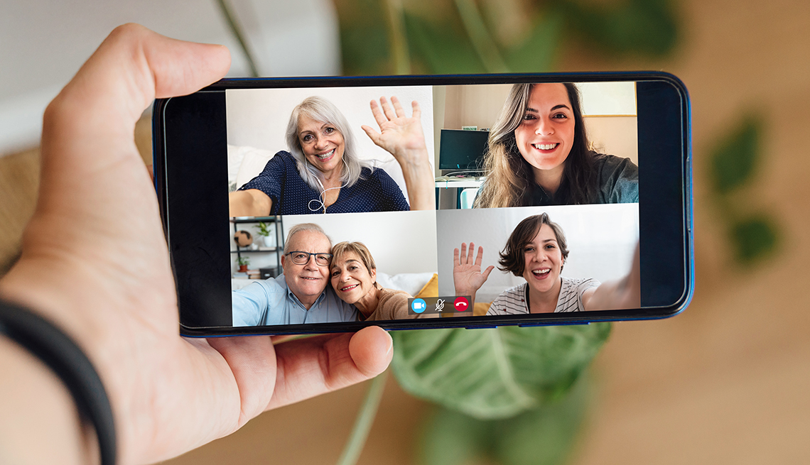 several people participate in a group video call on a smartphone