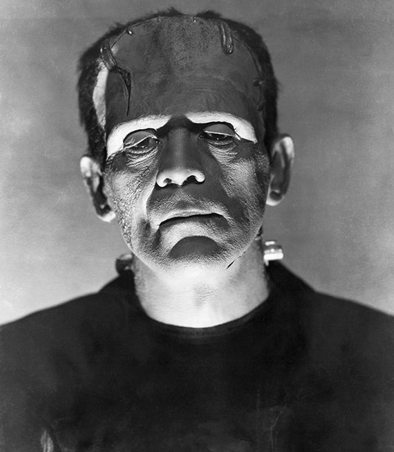 a black and white photo of Frankenstein as played by Boris Karloff