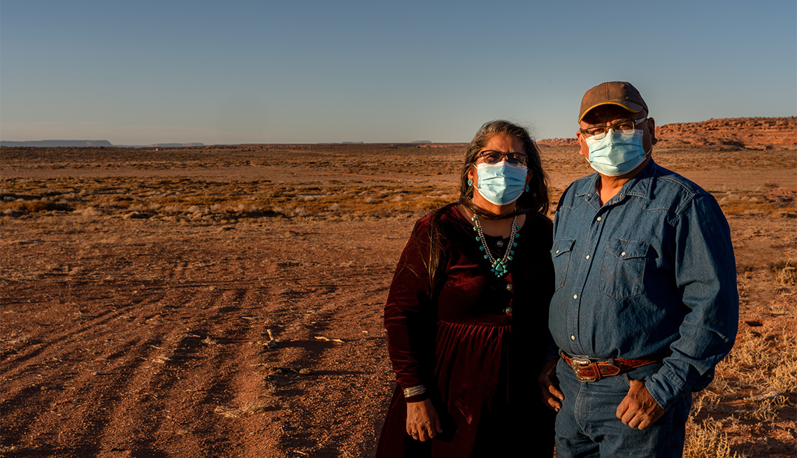 Native American couple wearing masks