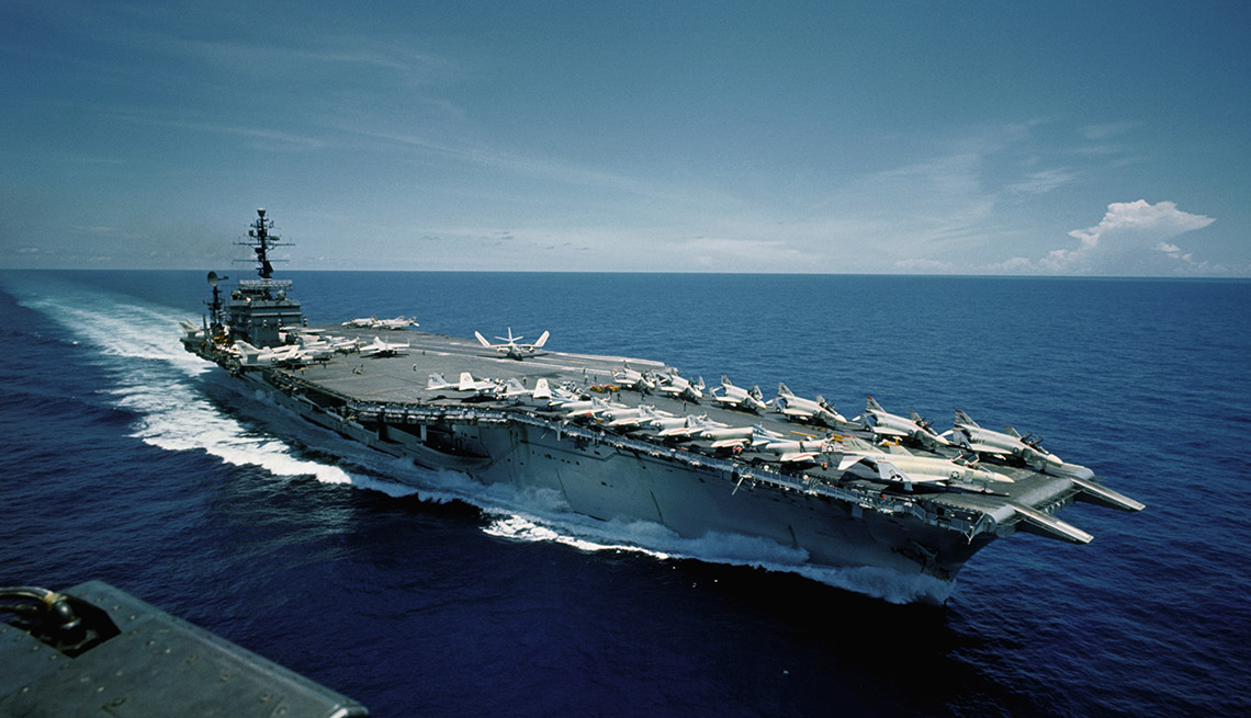Aerial views of the aircraft carrier USS Constellation at sea. Photograph taken on September 3, 1966