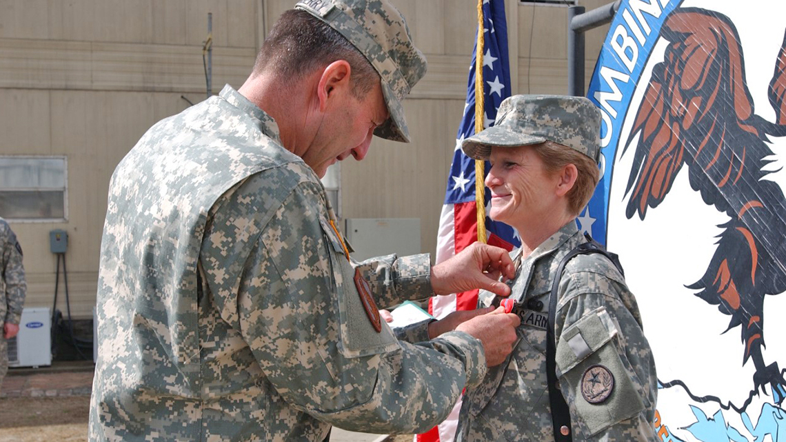 gretchen evans in uniform receiving the bronze star