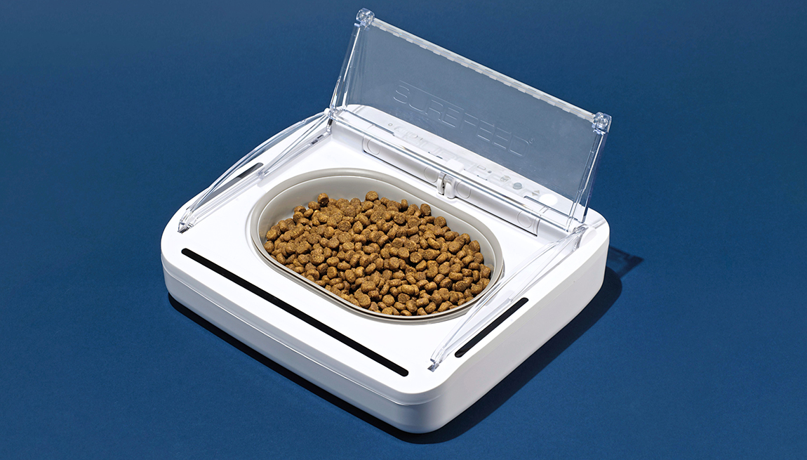 item 7 of Gallery image - a pet feeder containing pet food shown with its lid open