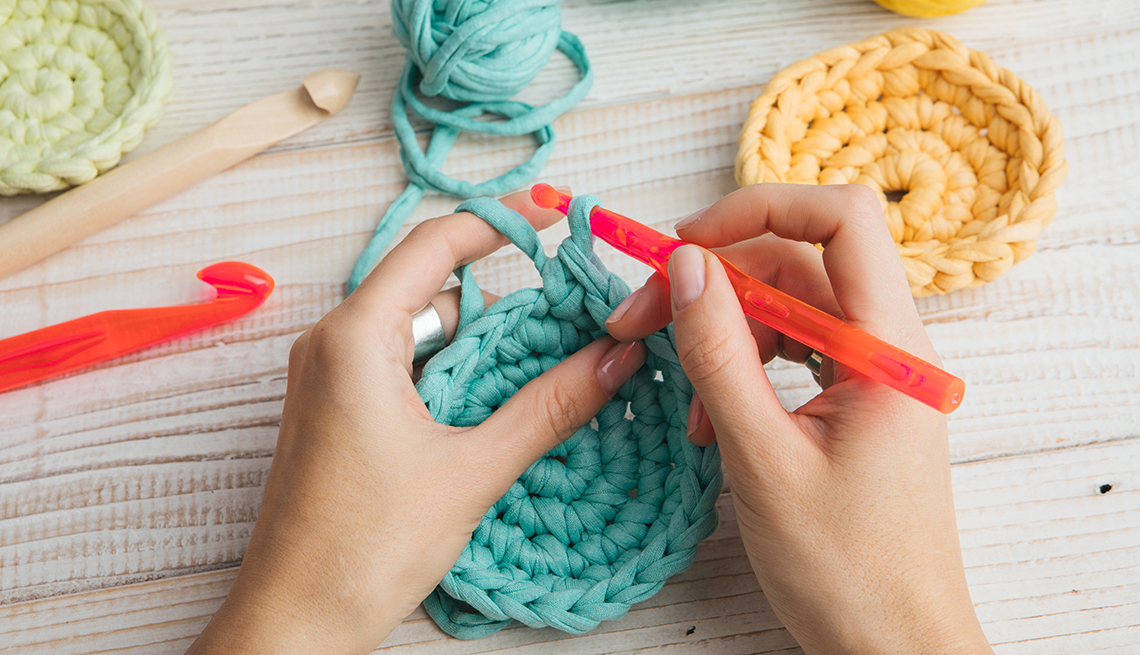Hand made hobby crafts things. woman hands knitting crochet.  