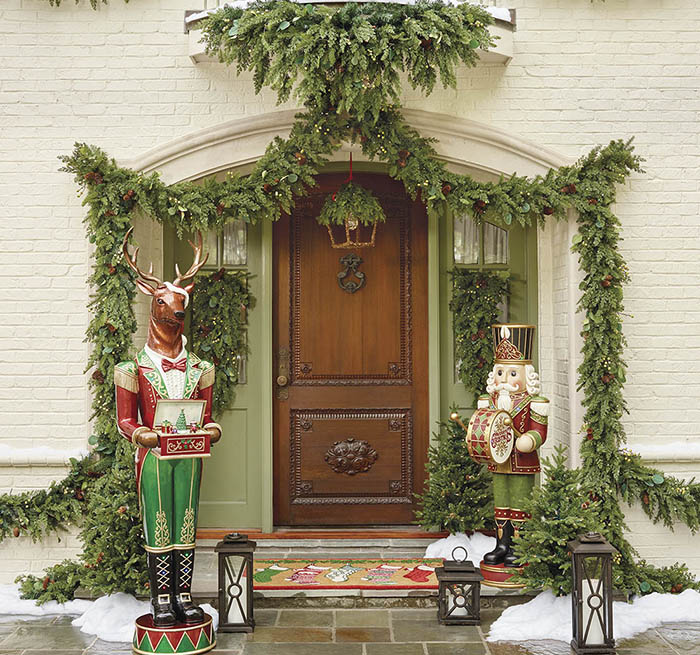 item 2 of Gallery image - Front door decorated in garland, with a dog smiling