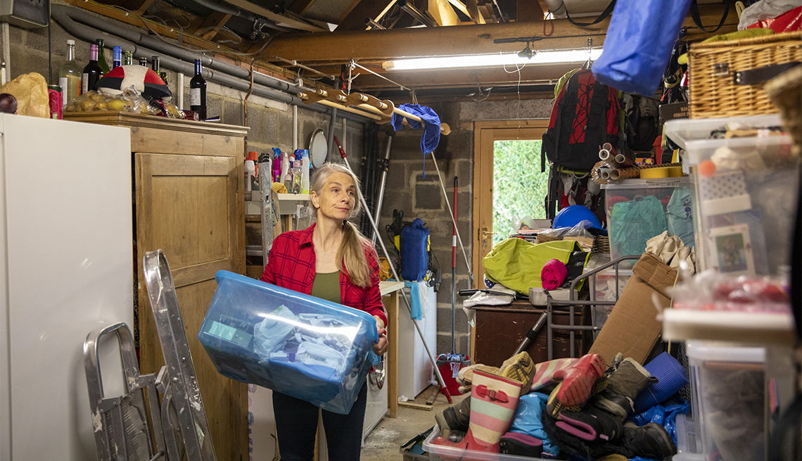 A woman organizes her garage