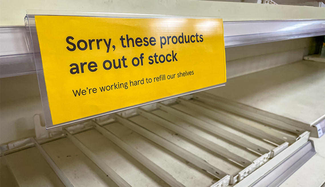 empty shelves and yellow out of stock sign