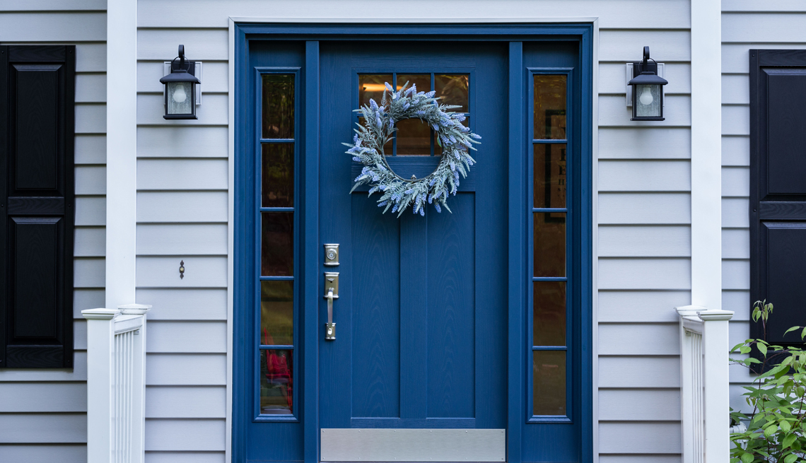a blue front door adding a blue door or painting your door blue is popular as are seasonal wreaths and windows to let in more light