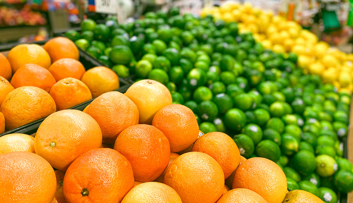 item 2 of Gallery image - oranges, limes and lemons on display in a grocery store