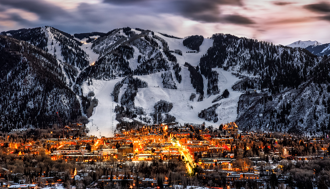 item 1 of Gallery image - evening view of the lights and town of aspen colorado at the base of a huge ski area mountain