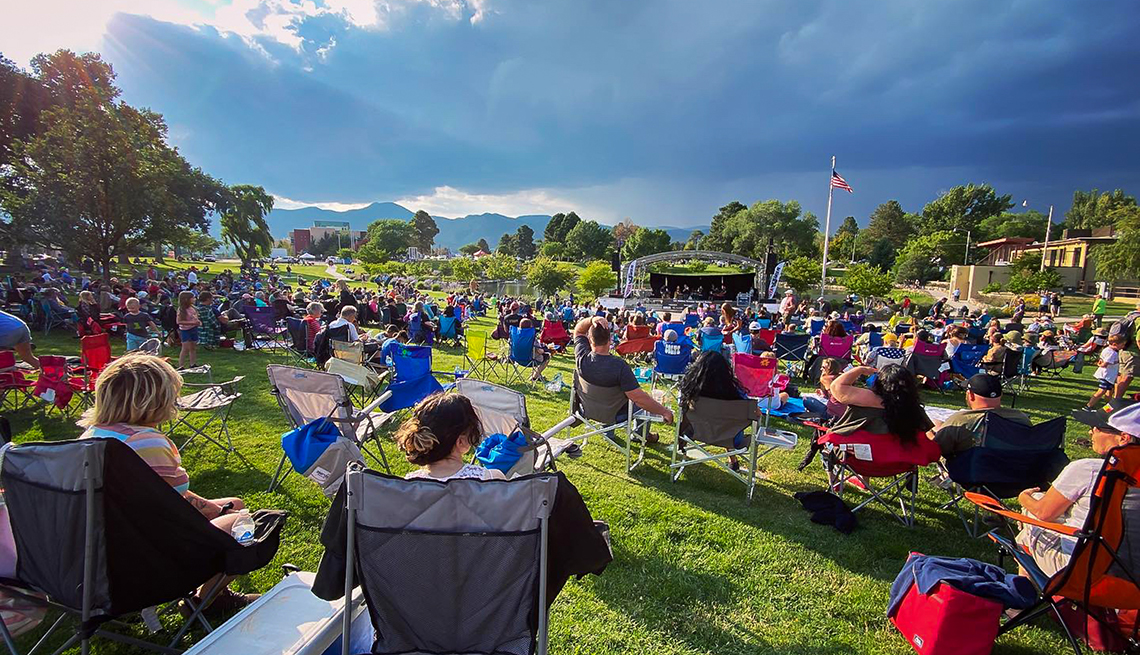 item 2 of Gallery image - people in lawn chairs watching a free outdoor concert in los alamos new mexico
