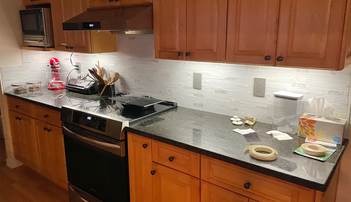 ann and ernest delmonico installed a glass tile backsplash in their kitchen