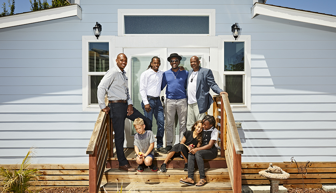 robert grant and his family on the porch of his new tiny home accessory dwelling unit