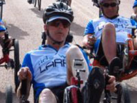 Larry Smith racing on recumbent bike.