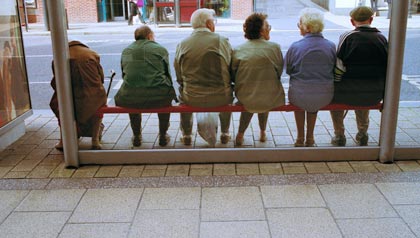 Senior people waiting at bus stop