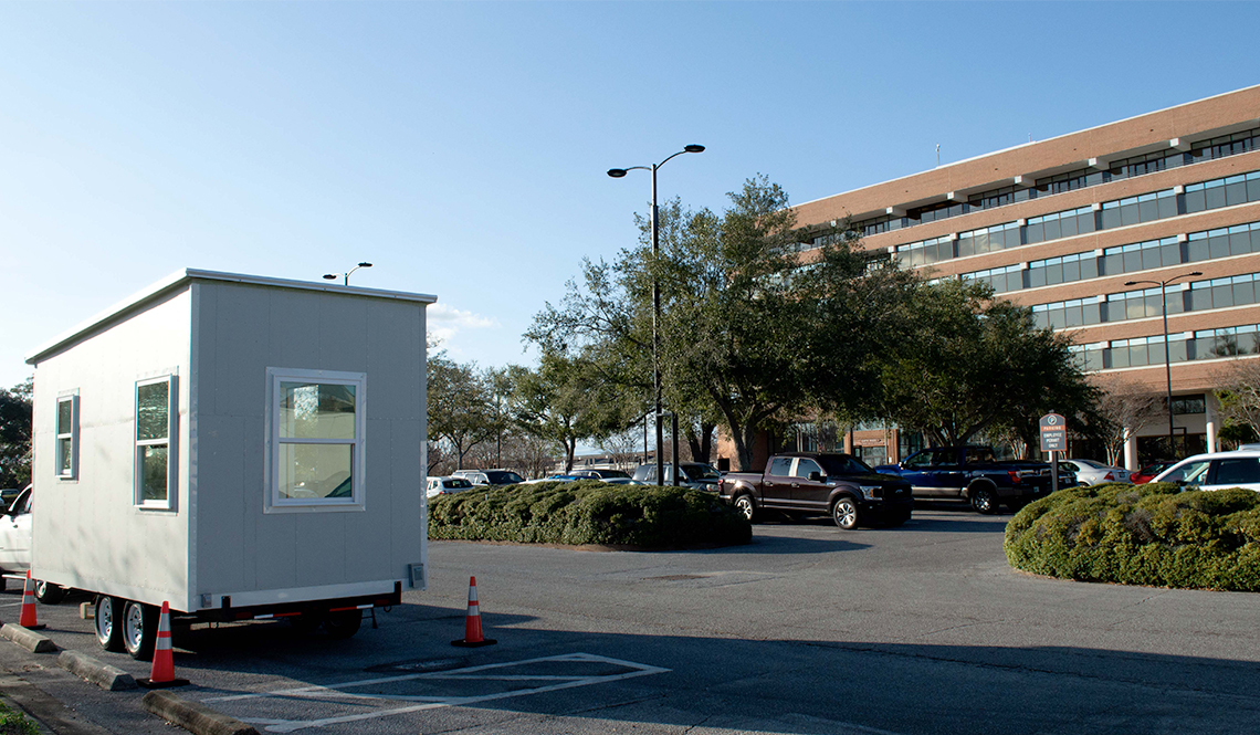 A tiny house on display in the parking lot of Pensacola City Hall