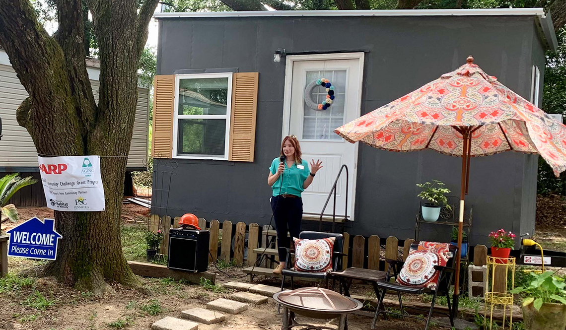 Emily Echevarria filming a video about the Council on Aging of West Florida's tiny house demonstration project