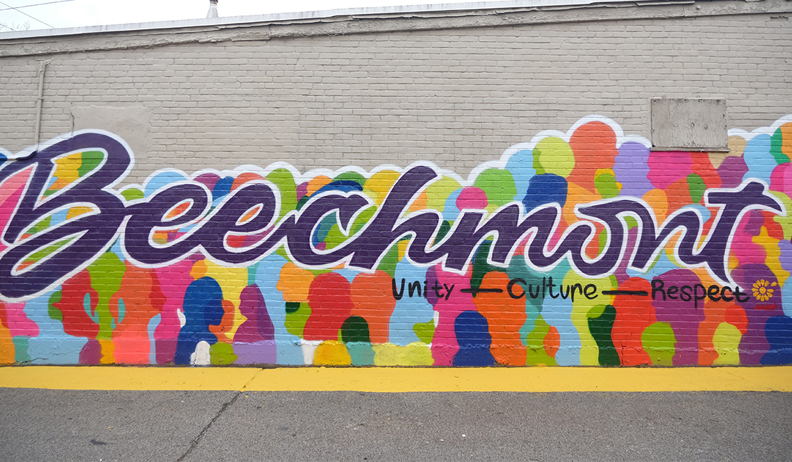 A colorful mural with the words Beechmont, Unity, Culture, Respect 