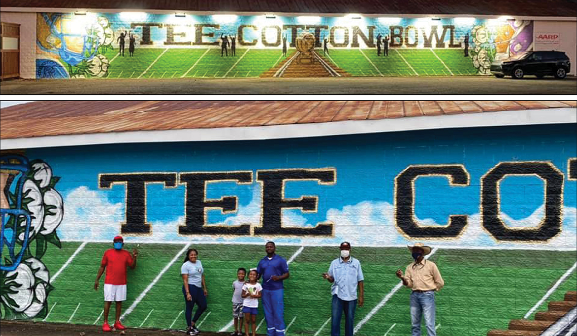 Volunteers stand in front of the Tee Cotton Bowl mural they helped create
