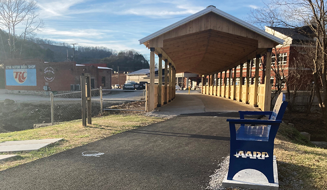 A blue, AARP-branded bench was installed in Whitesburg, Kentucky, with funding from the AARP Community Challenge